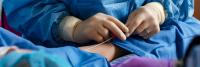 Interventional radiologists prepare to perform minimally invasive procedure.